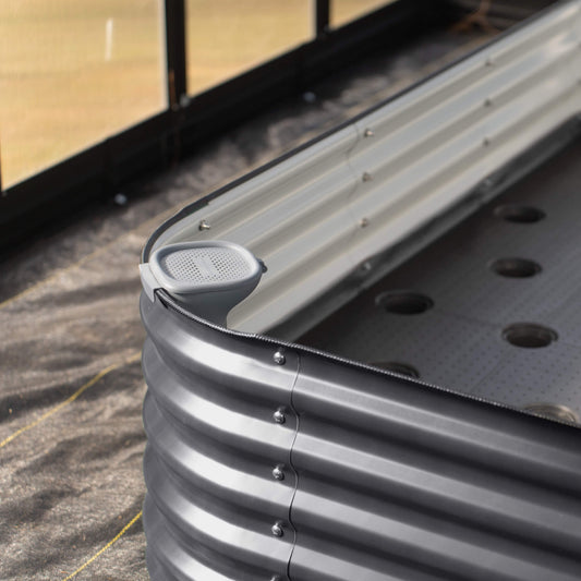 Self-Watering Wicking Floor system watering tube installed in a raised garden bed.