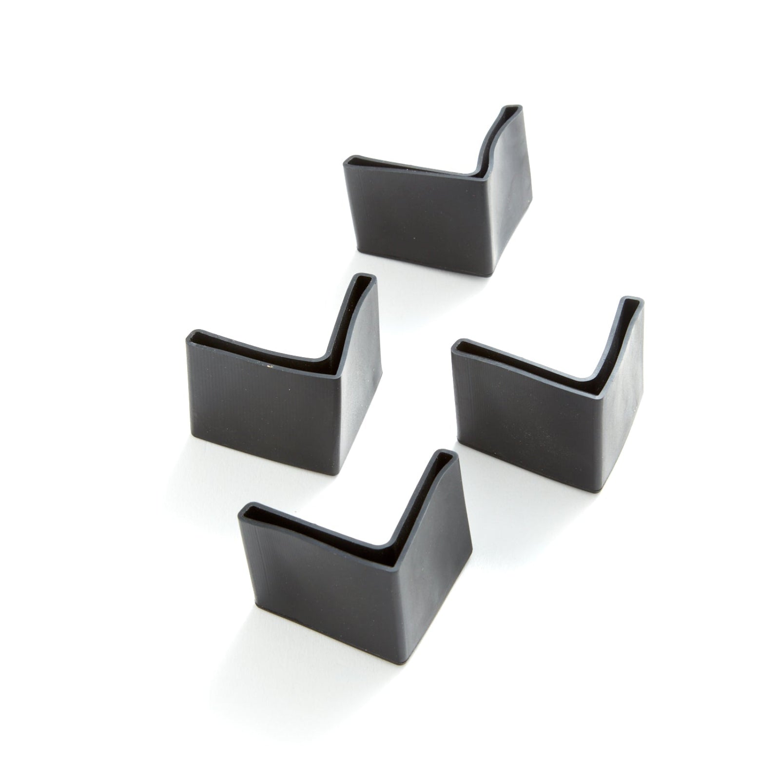 Set of black sleeve feet  on bed legs on a white background