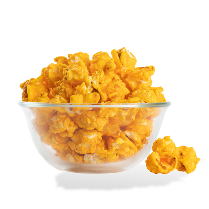 Sour Cream and Cheddar Popcorn popped in a bowl on a white background