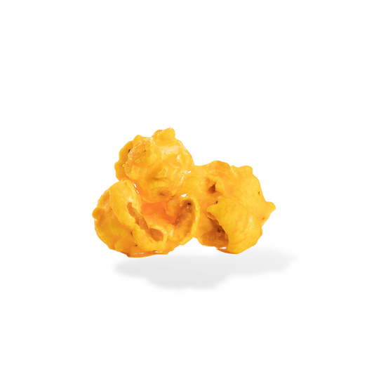 Three pieces of Sour Cream and Cheddar popcorn on a white background
