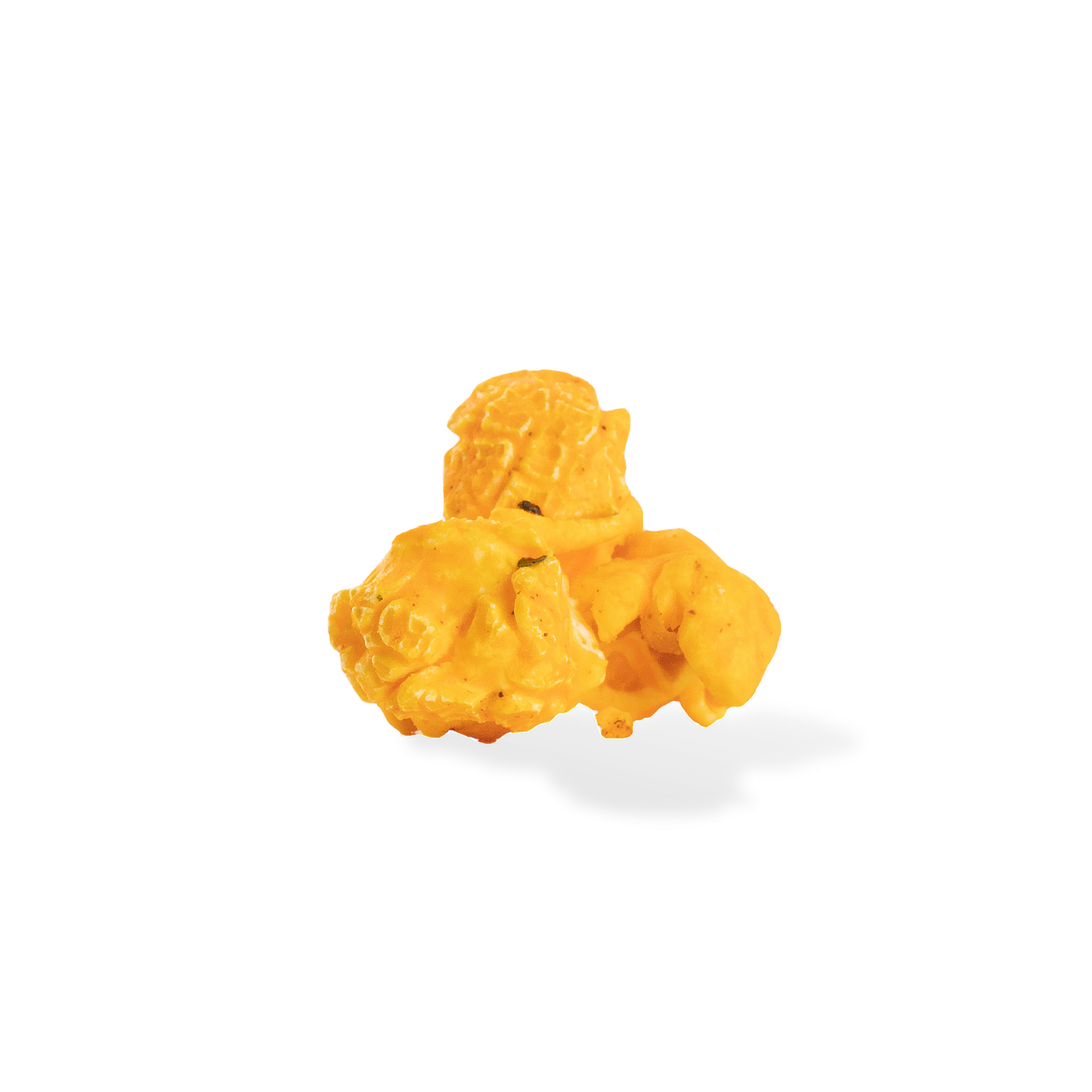 Three pieces of Spicy Buffalo popcorn on a white background