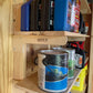 Shelf Bracket kit installed on an unfinished shed wall with various shed supplies neatly organized. 