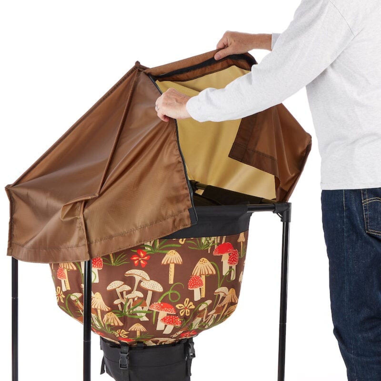 Person putting on the Urban Worm Weather Cover over the Urban Worm Bag on a white background