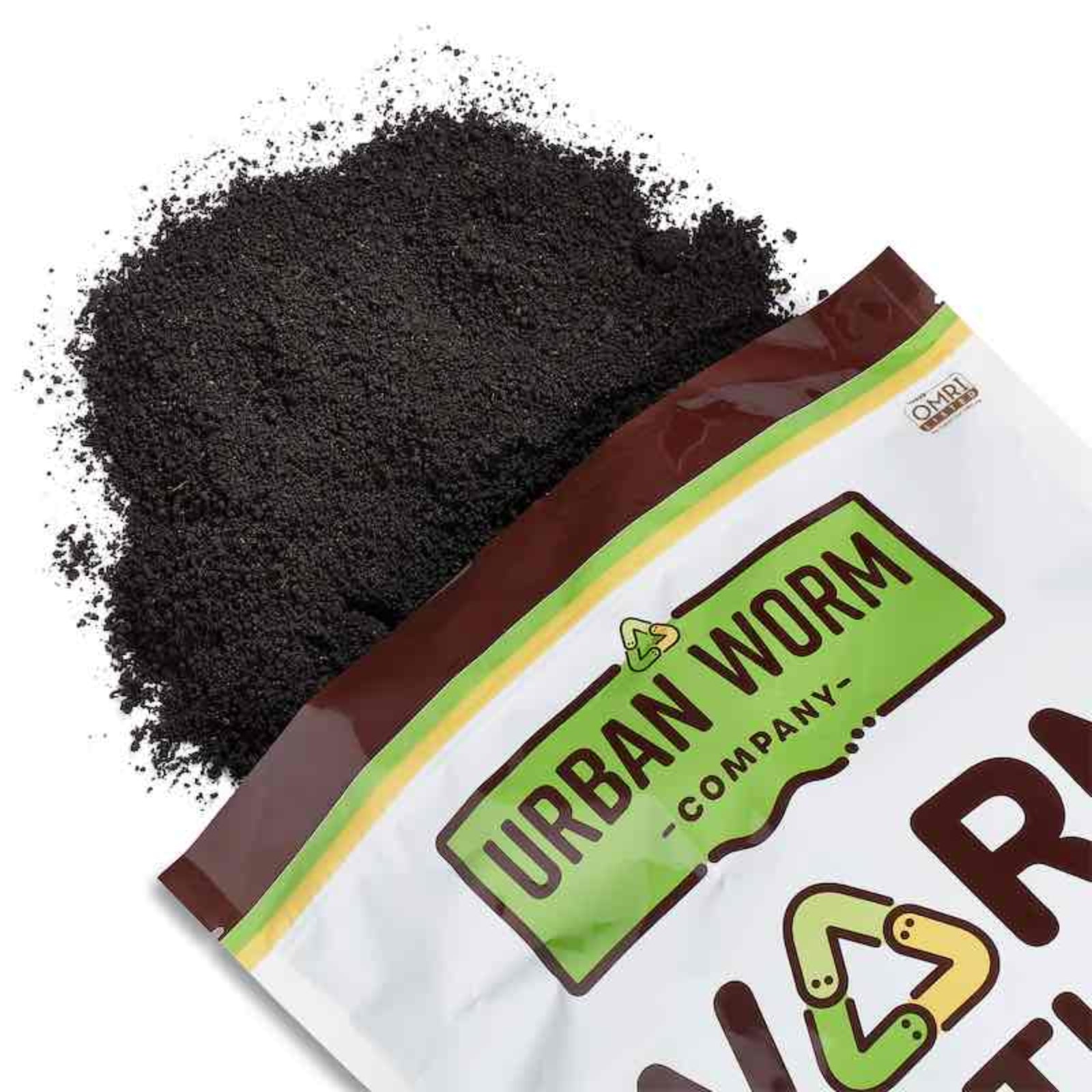 Bag of Urban Worm Company worm castings spilling out on a white background