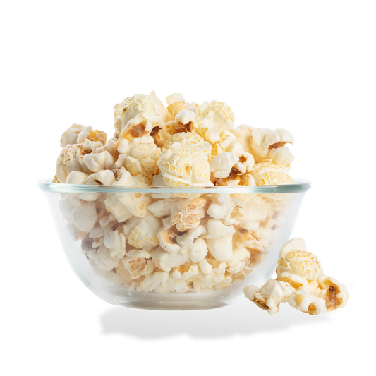 White Cheddar Popcorn popped in a bowl on a white background