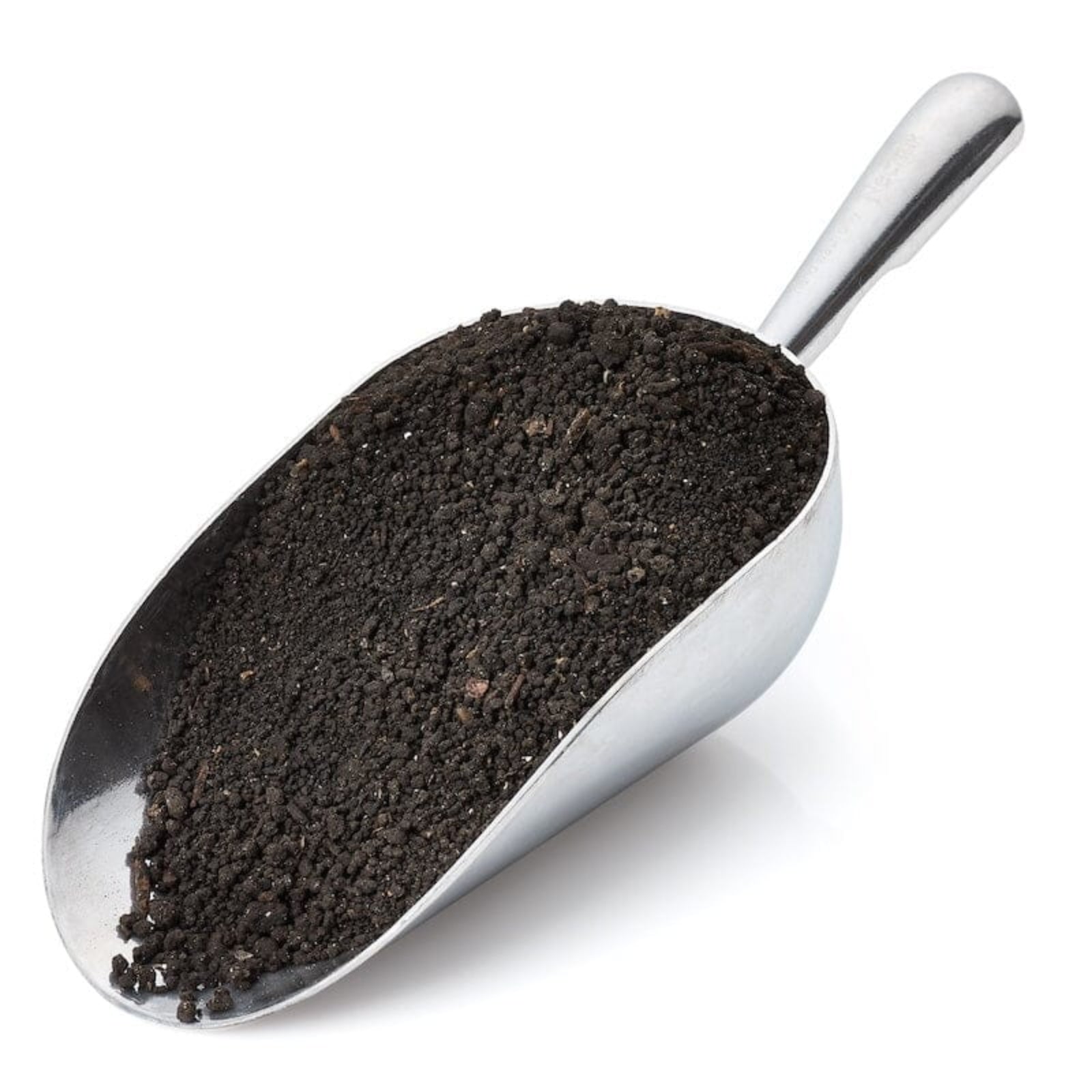 Metal scoop filled with worm castings on a white background