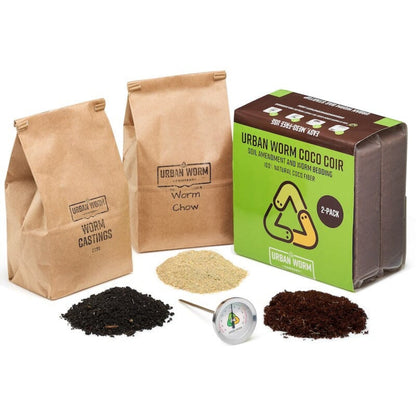 Urban Worm Success Bundle products including bags of 'Worm Castings' and 'Worm Chow', a block of 'Coco Coir', and a thermometer on a white background.