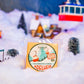 adelheid cheese block displayed in snow ski scene