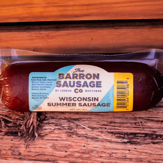 Packaged summer sausage on a wooden surface