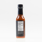 Back label of Carolina Reaper Hot Sauce bottle showing ingredients and nutrition facts