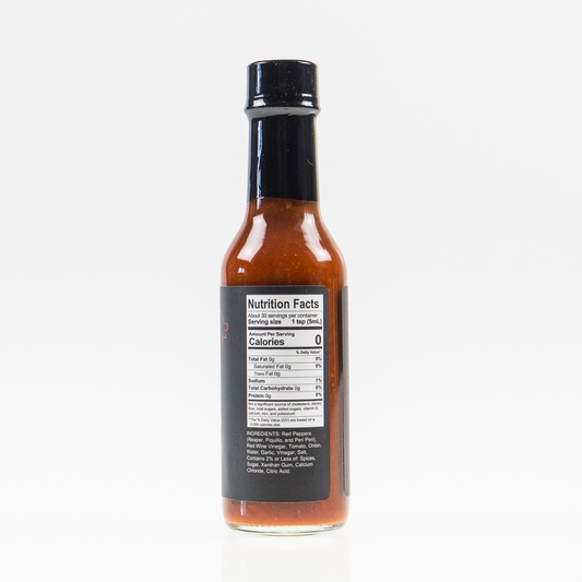 Back label of Carolina Reaper Hot Sauce bottle showing ingredients and nutrition facts