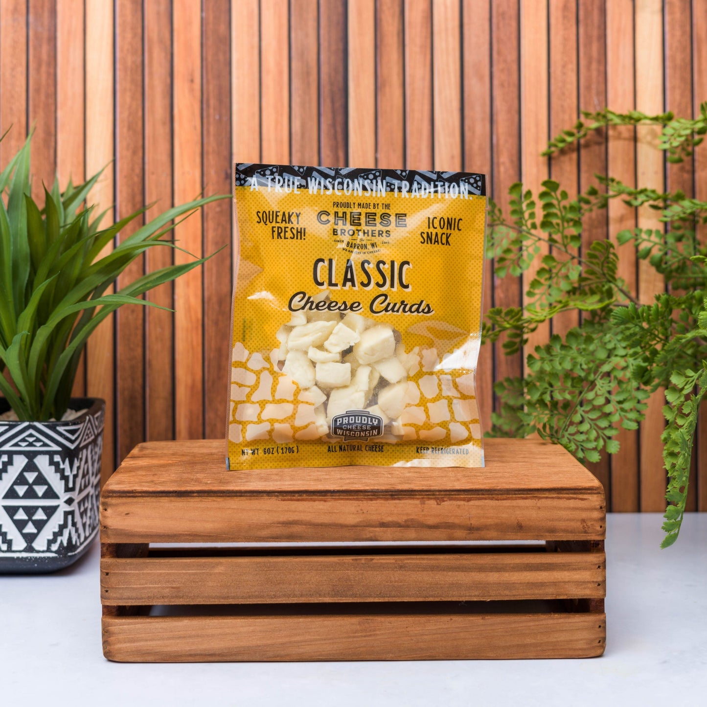 bag of classic wisconsin cheese curds on wooden box