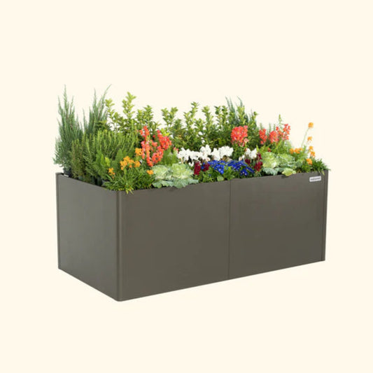 Urban Charcoal extra tall metal raised garden bed with colorful flowers and plants on a white background.