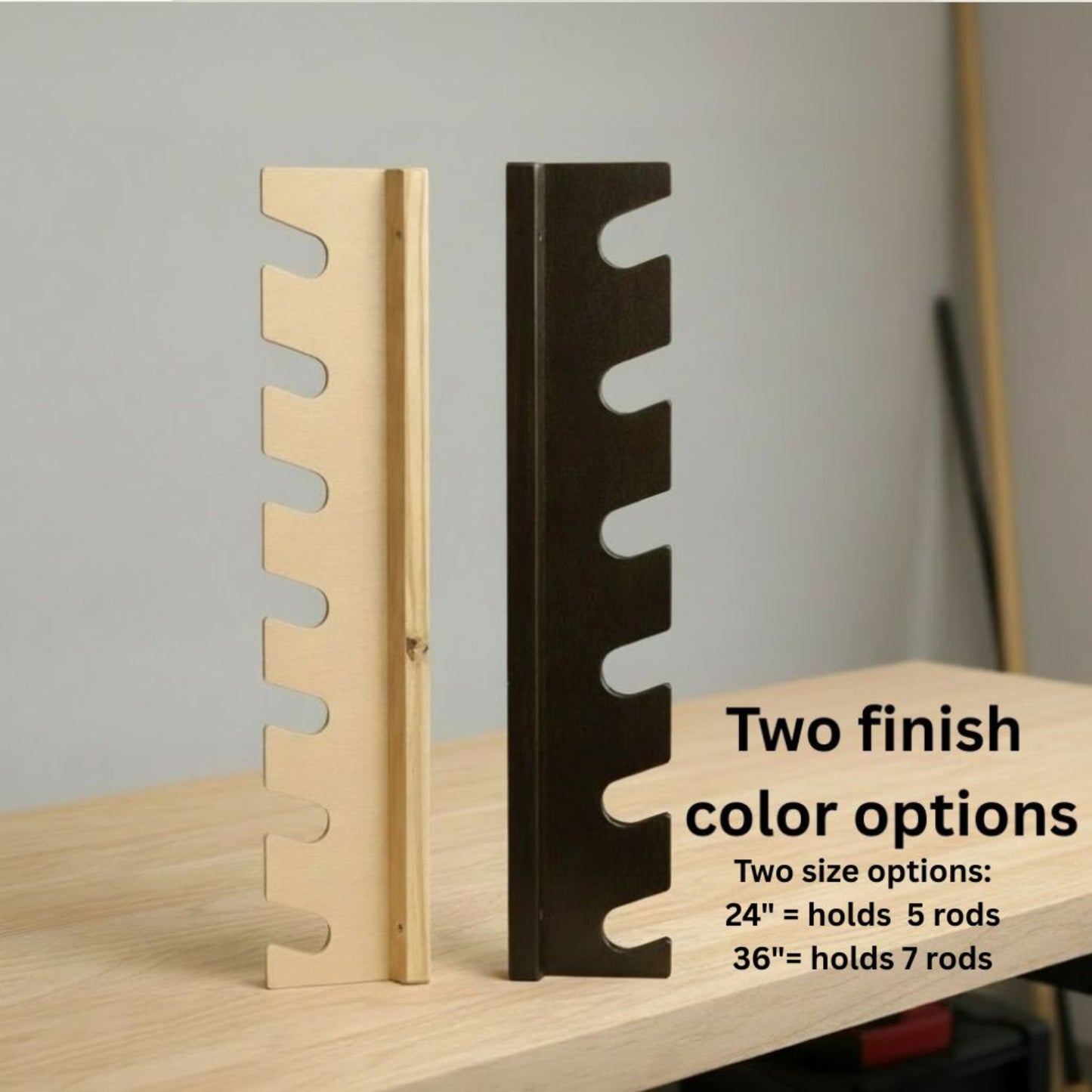 Two of the fishing rod rack side panels displayed on a workbench, showing natural wood and black finish options.