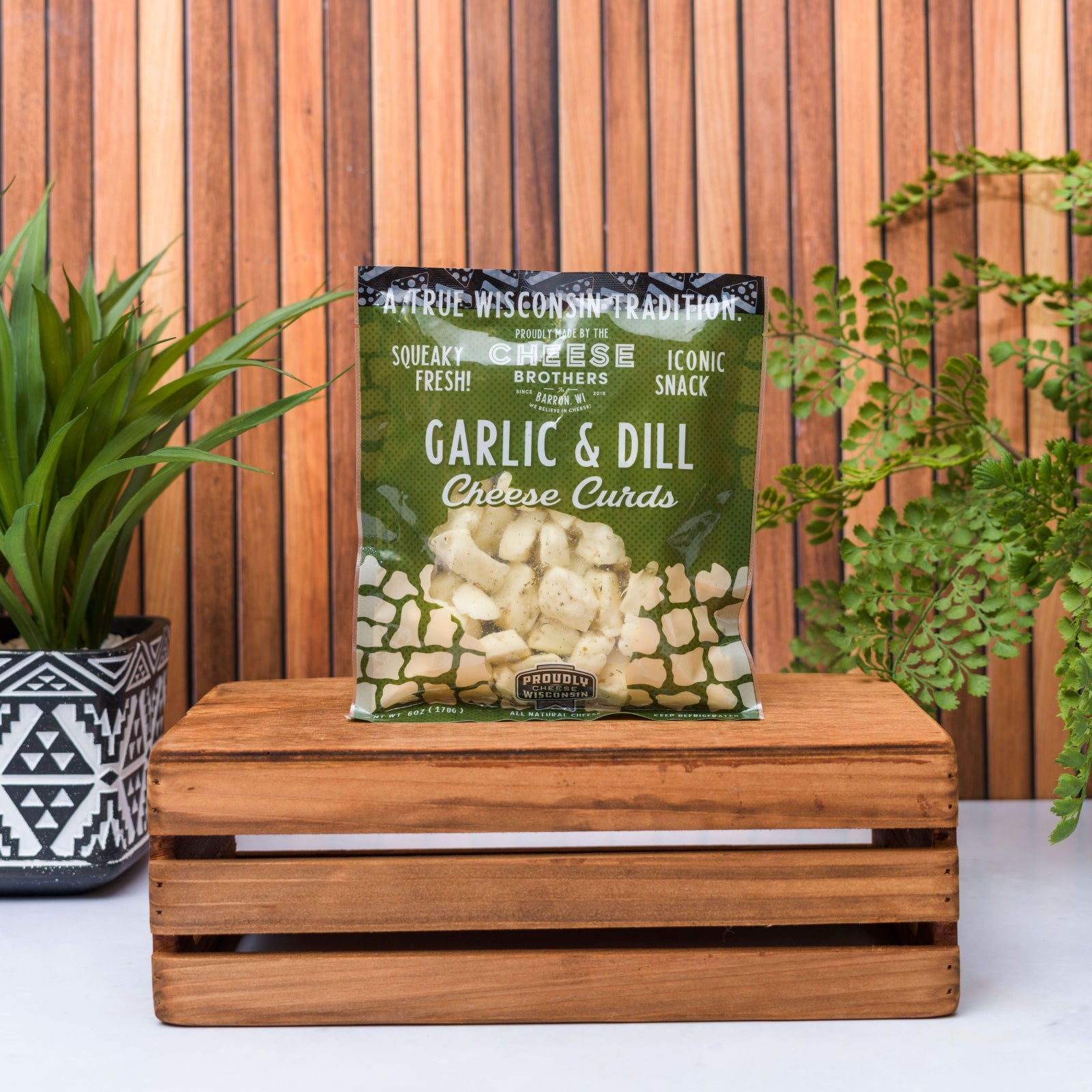 bag of garlic and dill wilconsin cheese curds on wooden box