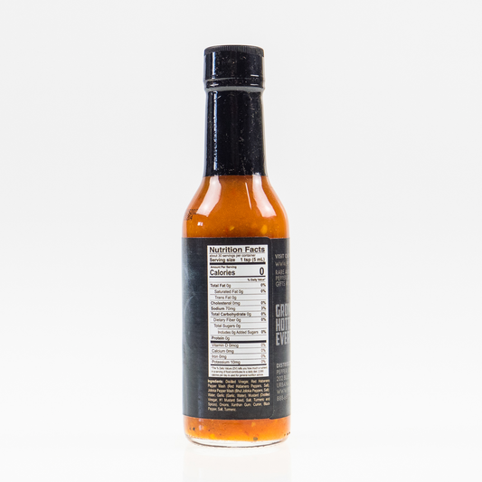 Back label of Ghost Pepper Hot Sauce bottle showing ingredients and nutrition facts