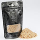 Black packaging with visible spices in the ghost pepper naga jolokia sea salt on a white background