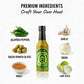 Jalapeno Hot Sauce bottle surrounded by fresh premium ingredients like jalapeno peppers, green Spanish olives, honey, lime juice and spices used to make the sauce.