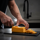pepper joes scorpion cheddar Cheese being cut with backlighting