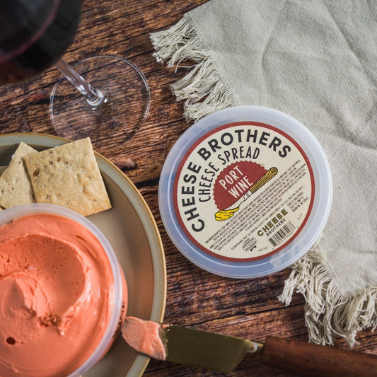 cheese brothers port wine cheese spread on wooden table with crackers