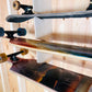 Close-up of a skateboard organizer wood grain installed on the stud and skateboards in the rack.