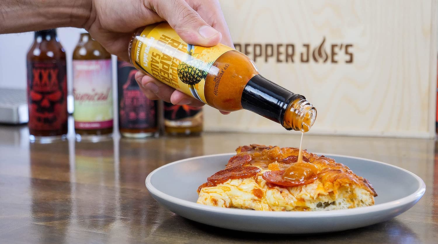 Pepper Joe's Carolina Reaper Hot Sauce gift pack - Pineapple Reaper hot sauce pour on pizza