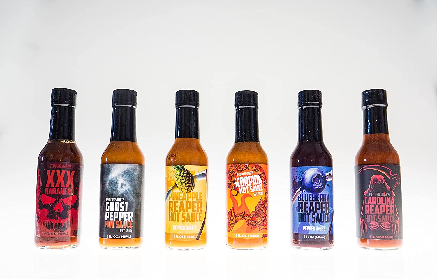 Pepper Joe's Superhot Hot Sauce Pack - six hot sauces lined up on white background