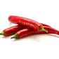 Pepper Joe's Cow Horn pepper seeds - pile of cowhorn hot peppers on white background