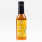 Pepper Joe's Pineapple Reaper hot sauce on white background, close up of label