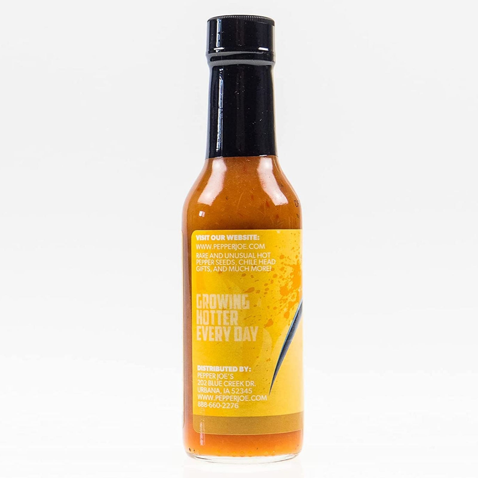 Pepper Joe's Pineapple Reaper hot sauce on white background, close up of label