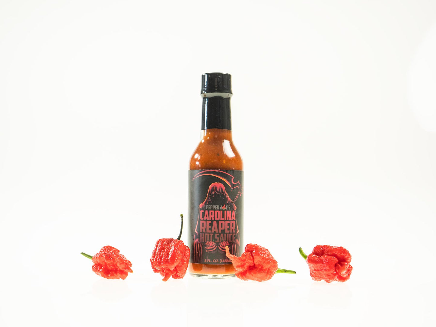 Pepper Joe's Carolina Reaper Hot Sauce Pack - Carolina Reaper hot sauce bottle with red Reapers around sauce