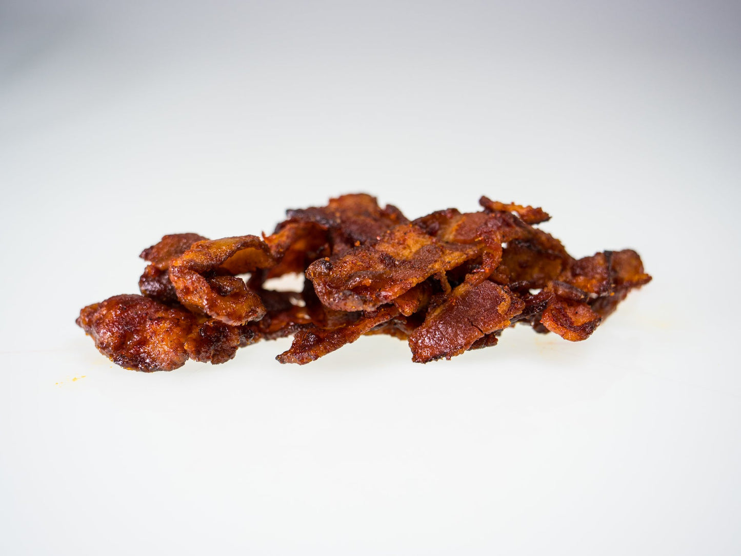 Carolina Reaper Bacon Jerky up close shot on white background