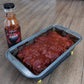 Pepper Joe's ghost pepper ketchup - hot and spicy ketchup spread on meatloaf in baking pan 