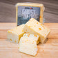 Pepper Joe's spicy Ghost Pepper Monterey Jack Cheese block on wood cutting board