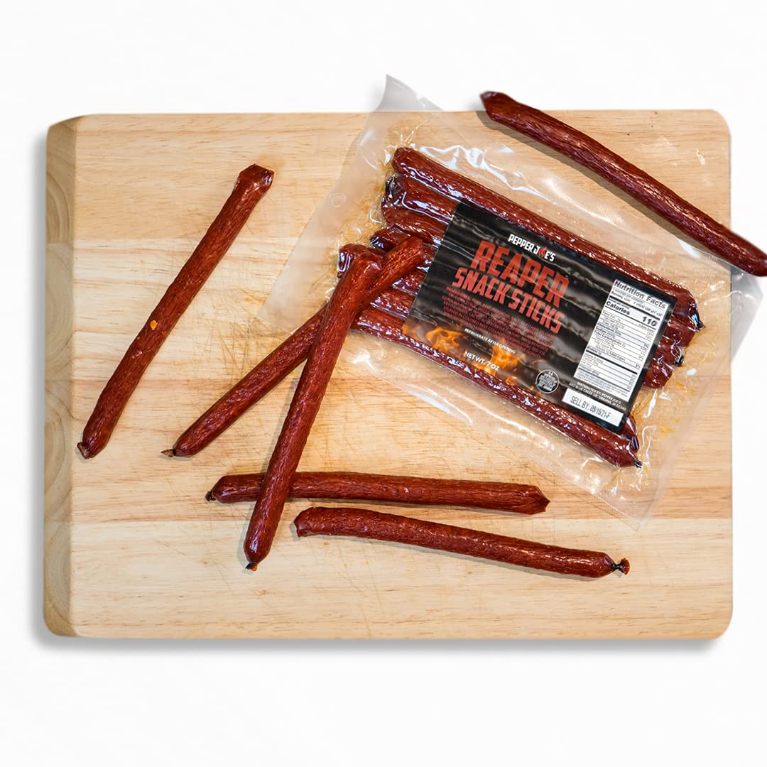 Pepper Joe's Carolina Reaper Snack Sticks - spicy meat snacks on wooden cutting board on white background